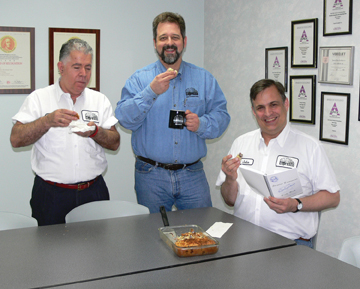 Manuel Duran, Steve Johnson and John Ruder eat cake